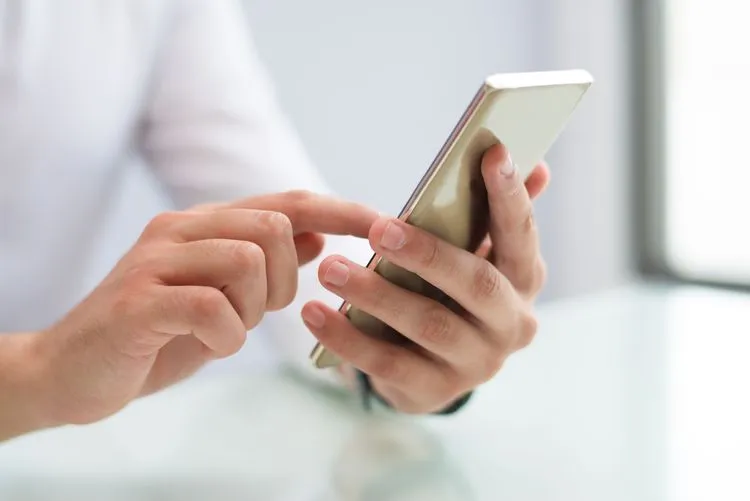 close-up-male-hands-using-smartphone.jpg