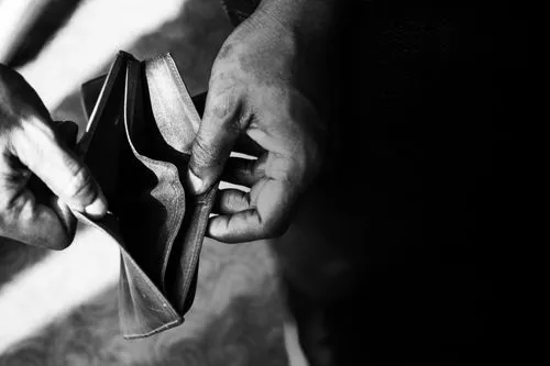 man-checking-his-empty-wallet.jpg